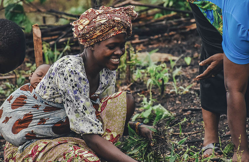 African woman sowing crops